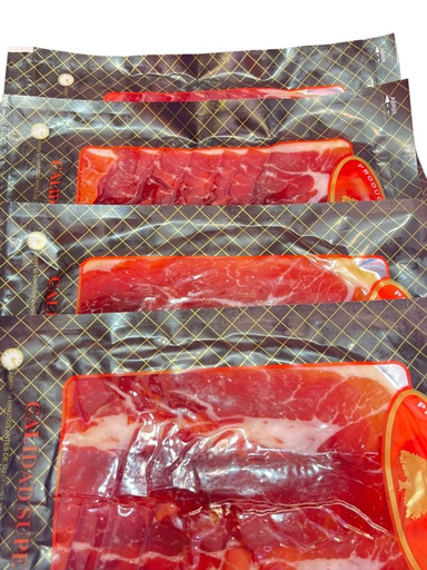 Lonchear y envasar al vacío su  jamón o paletilla a maquina